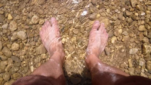 Soaking the feet in clean and cold water Stock Footage 331258419