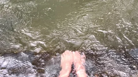 Soaking feet stream1 Stock Footage 323242550