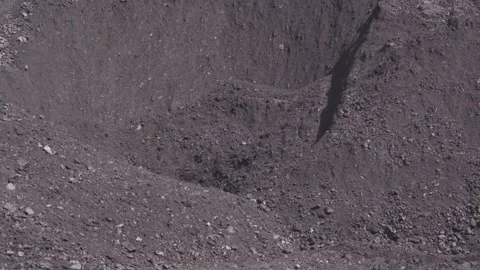 Сoal from the storage yard is dropped into an underground bunker Stock Footage 312832924