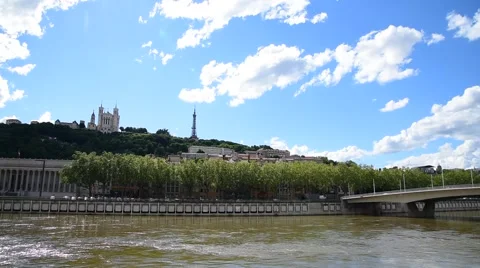 Soane river view with cathedrals Saint-Georges and Fourviere under blue sky. Stock Footage 64239717