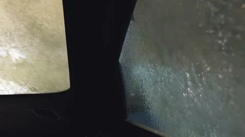 Soap and brushes cleaning a car window during an automated wash. Stock Footage 280077951