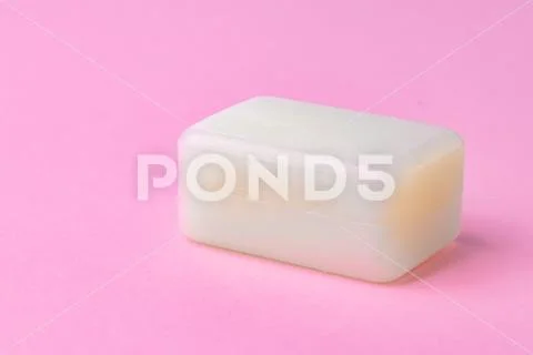 Soap bar isolated on pink background. Close up. Stock Photos