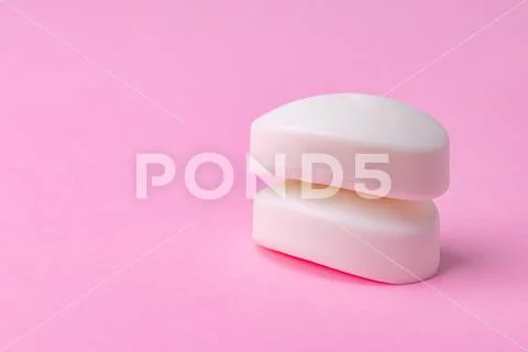 Soap bar isolated on pink background. Close up. Stock Photos