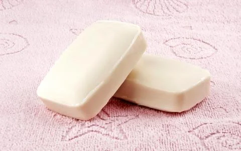 Soap on bath towel Stock Photos