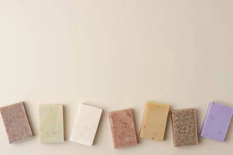 Soap on beige background. Flat lay, copy space. Foto stock
