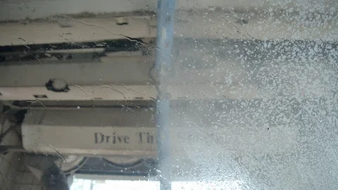 Soap being applied to car in car wash in slow motion POV, 4k Stock Footage 114004995