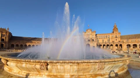 Soap bubble and rainbow at Plaza de Espana fountain in Seville Stock Footage 346058258