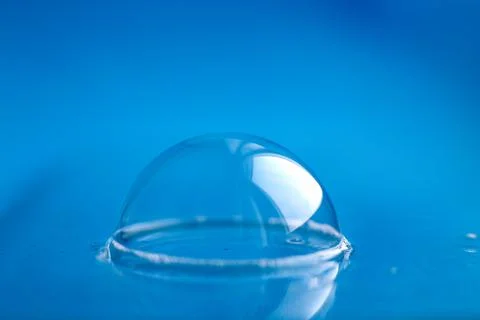 Soap bubble close up. abstract blue water background Fotos Stock