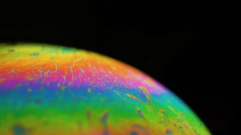 Soap bubble creates a colorful and psychedelic, rainbow palette with swirls Stock Footage 124873930