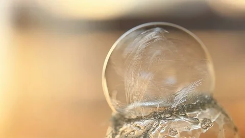Soap Bubble Freezing and Forming Crystals with Shallow Depth of Field Stock Footage 100522065