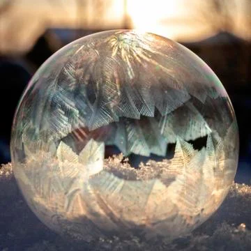 A soap bubble freezing in sun Stock Photos