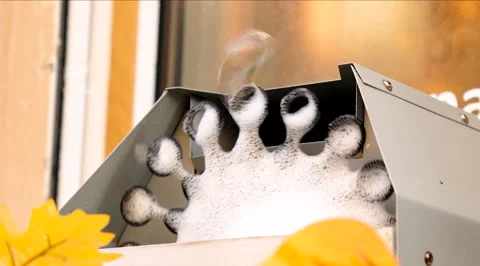 Soap bubble generator produces soap bubbles on open air outdoor. \ Video stock 291308954