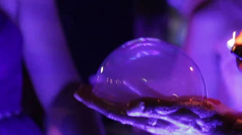 A soap bubble is illuminated on the hand Stock Footage 67477352