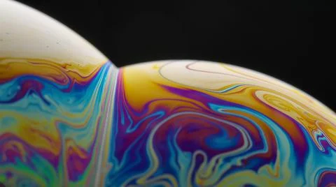 Soap bubble macro rainbow colors creating multicolored patterns. Colorful foam Foto stock