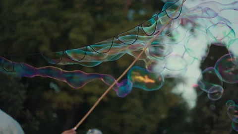 Soap Bubble Performer Creating Giant Bubble Stock Footage 340324570