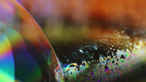 Soap bubble rainbow lens flare colorful oil paint Stock Footage 261727215
