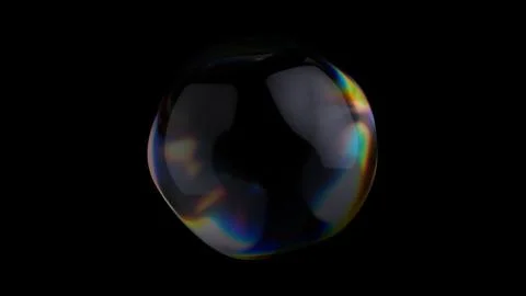 Soap bubble showing iridescence effect on dark background Stock Photos