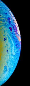 Soap bubble surface on black background . Stock Photos