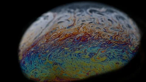 Soap bubble surface macro resembling alien planet landscape, mountainous Stock Footage 324952326