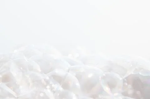 Soap bubble on a white background . Stock Photos