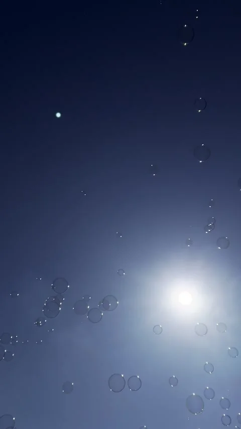 Soap bubbles against blue sky Stock Footage 311401834