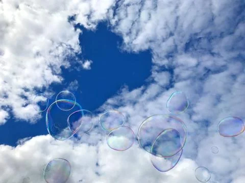 Soap bubbles against sky. Stock Photos