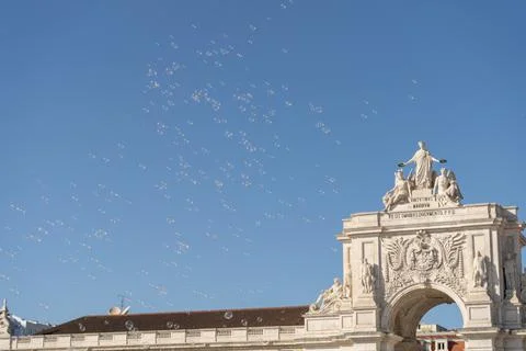 Soap bubbles in the air with historical structures in the background Stock Photos