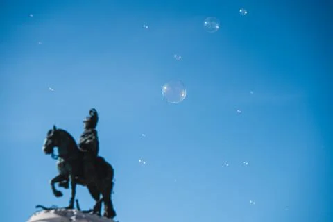Soap bubbles in the air with historical structures in the background Stock Photos