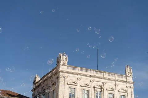Soap bubbles in the air with historical structures in the background Stock Photos