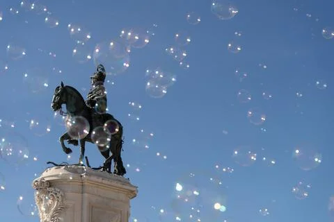 Soap bubbles in the air with historical structures in the background Stock Photos