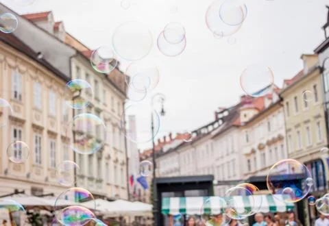 Soap bubbles on background of old town Stock Photos