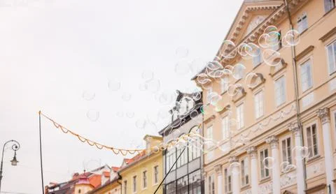 Soap bubbles on background of old town Stock Photos