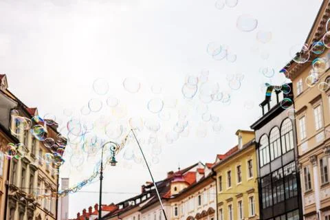 Soap bubbles on background of old town Stock Photos
