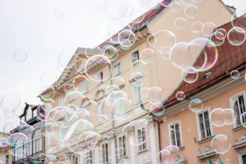 Soap bubbles on background of old town Stock Photos