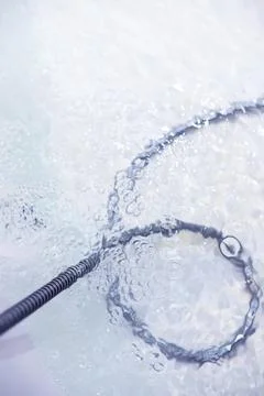 Soap bubbles background. Shampoo foam in the water in the bathroom. Jacuzzi.. Stock Photos