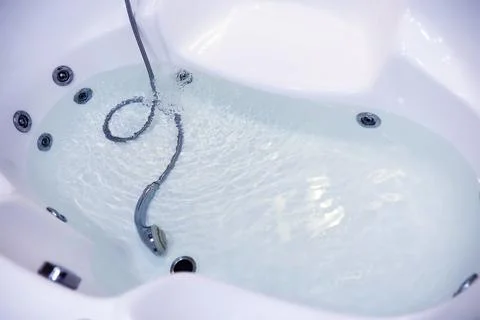 Soap bubbles background. Shampoo foam in the water in the bathroom. Jacuzzi.. Stock Photos