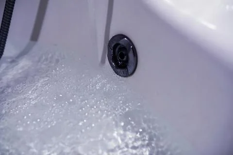 Soap bubbles background. Shampoo foam in the water in the bathroom. Jacuzzi.. Stock Photos