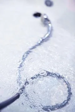 Soap bubbles background. Shampoo foam in the water in the bathroom. Jacuzzi.. Stock Photos