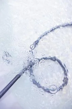 Soap bubbles background. Shampoo foam in the water in the bathroom. Jacuzzi.. Stock Photos