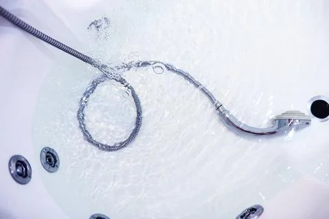 Soap bubbles background. Shampoo foam in the water in the bathroom. Jacuzzi.. Stock Photos