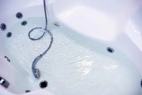 Soap bubbles background. Shampoo foam in the water in the bathroom. Jacuzzi.. Stock Photos