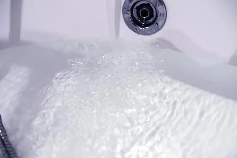 Soap bubbles background. Shampoo foam in the water in the bathroom. Jacuzzi.. Stock Photos