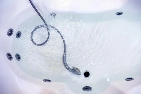 Soap bubbles background. Shampoo foam in the water in the bathroom. Jacuzzi.. Stock Photos