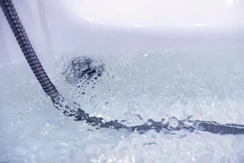 Soap bubbles background. Shampoo foam in the water in the bathroom. Jacuzzi.. Stock Photos