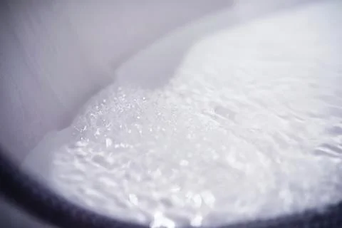 Soap bubbles background. Shampoo foam in the water in the bathroom. Jacuzzi.. Stock Photos