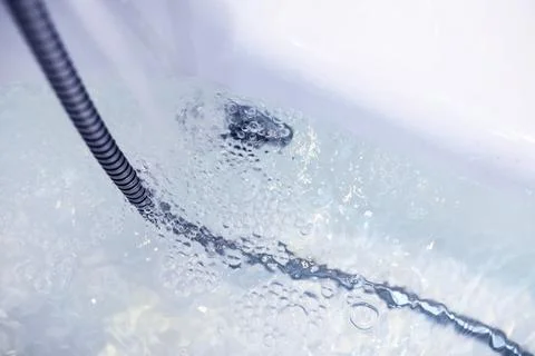 Soap bubbles background. Shampoo foam in the water in the bathroom. Jacuzzi.. Stock Photos
