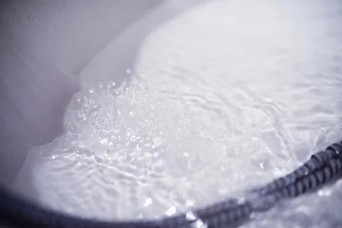 Soap bubbles background. Shampoo foam in the water in the bathroom. Jacuzzi.. Stock Photos