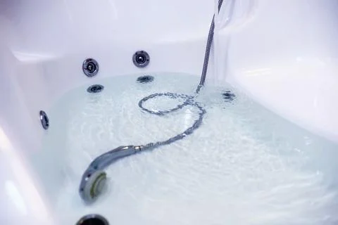 Soap bubbles background. Shampoo foam in the water in the bathroom. Jacuzzi.. Stock Photos