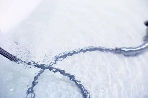 Soap bubbles background. Shampoo foam in the water in the bathroom. Jacuzzi.. Stock Photos