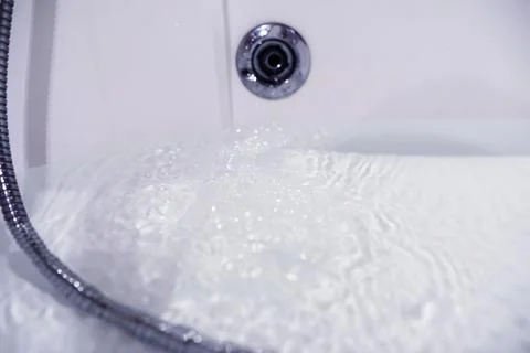 Soap bubbles background. Shampoo foam in the water in the bathroom. Jacuzzi.. Stock Photos